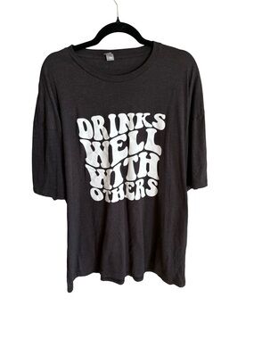 Black Short-Sleeve Graphic Tee with 'Drinks Well With Others'